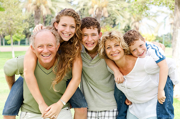 belleview-dentistry-co Picture of a happy family in the field